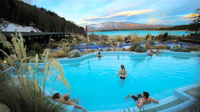 Relax in the stunning hot pools at Tekapo Springs, overlooking the Lake and Two Thumb Mountain range.